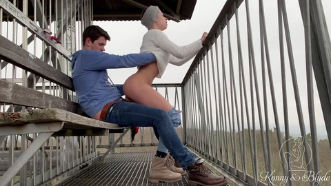 Risky outdoor sex on a public observation tower in the woods almost caught on camera