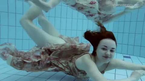 Two sizzling babes with natural fur take a dip underwater