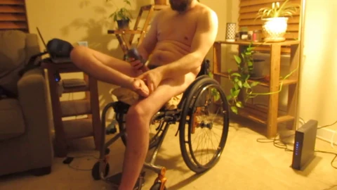 Disabled man in wheelchair experiences intense pleasure and muscle spasms